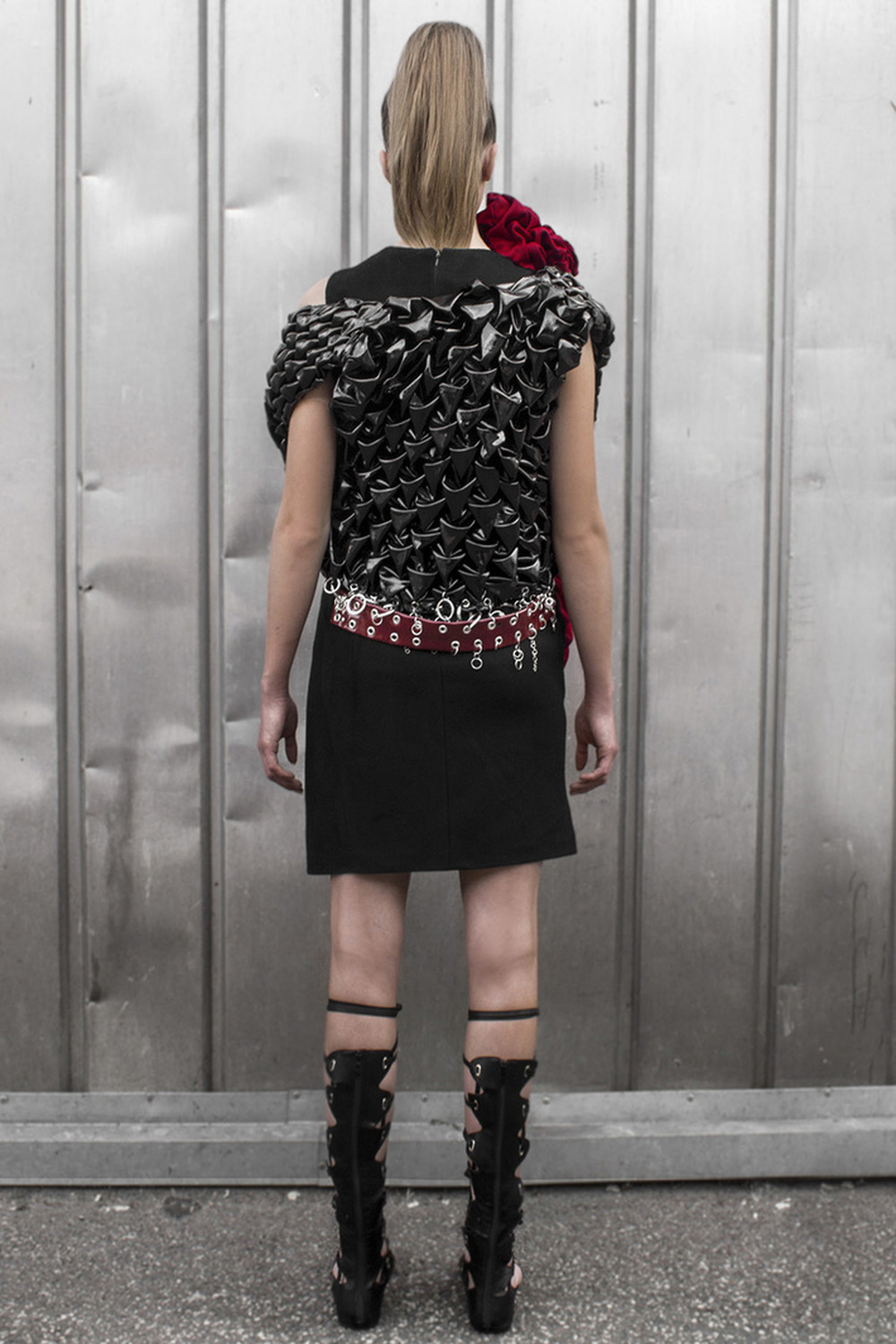 Look 1

Asymmetric cashmere dress with a hand-smocked, lacquered
leather vest. Hand embroidered with raw metal embellishments 
