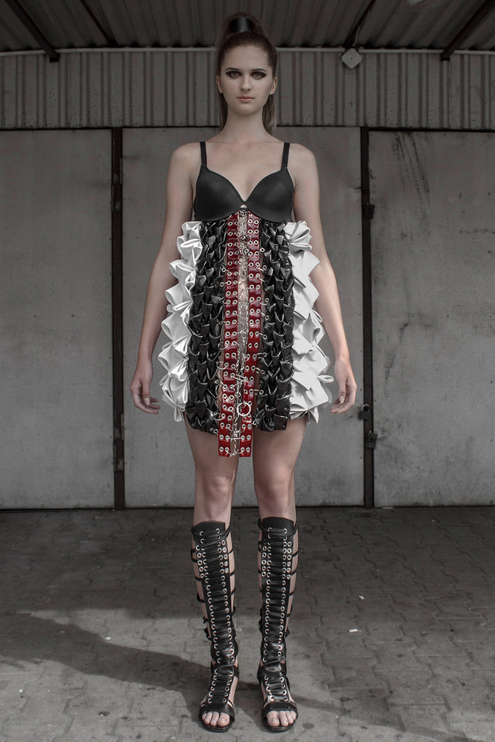Look 8

Hand-smocked, sculptural, leather dress with raw, metal embellishments 